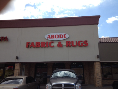 Abode Fabric, Rugs and Upholstery Logo