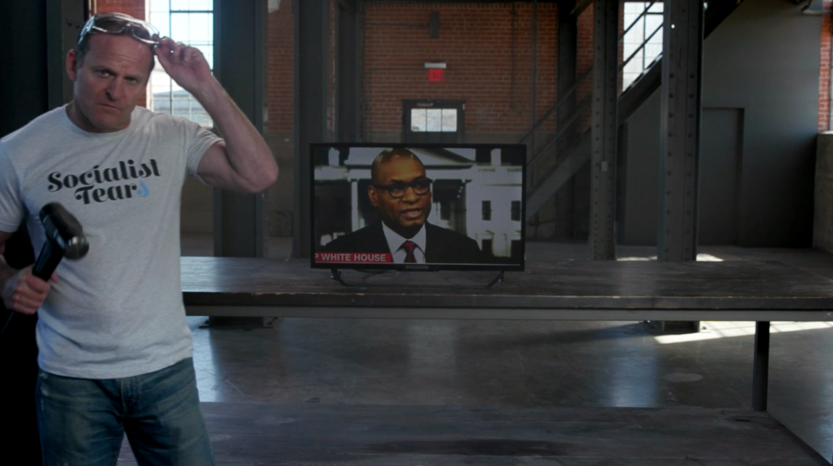 NRATV host smashes television with a sledgehammer to defend Trump