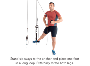 Stand sideways to the anchor and place on foot in a long loop. Externally rotate both legs.