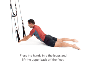 Press the hands into the loops and lift the upper back off the floor.