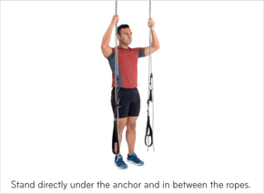 Stand directly under the anchor and in between the ropes.