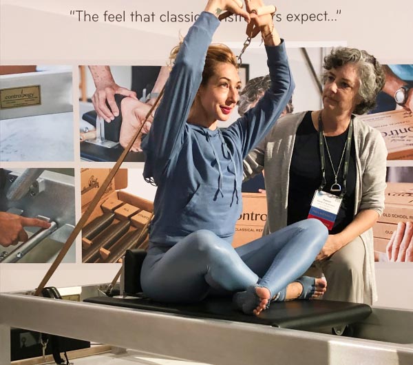 Woman working out on Contrology Reformer at PMA
