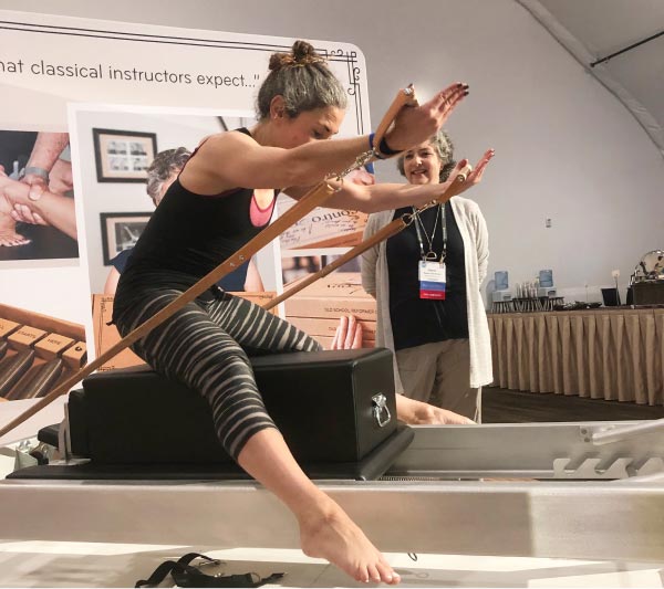 Woman working out on Contrology Reformer at PMA