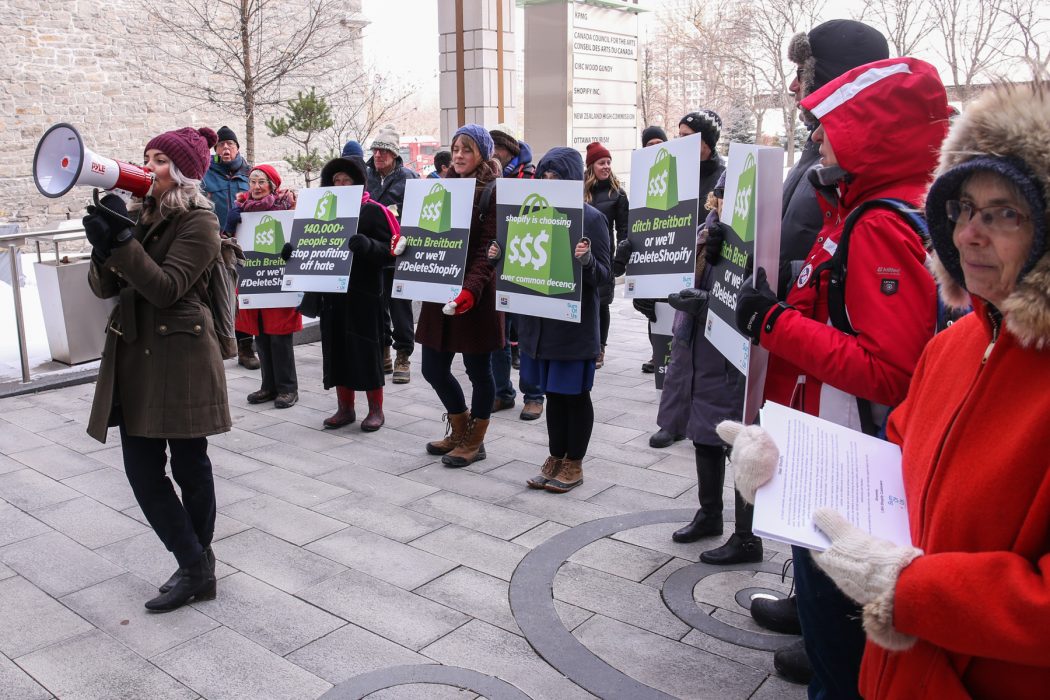 Photo: SumOfUs members outside Shopify's headquarters in Canada before it announced its updated acceptable usage policy.