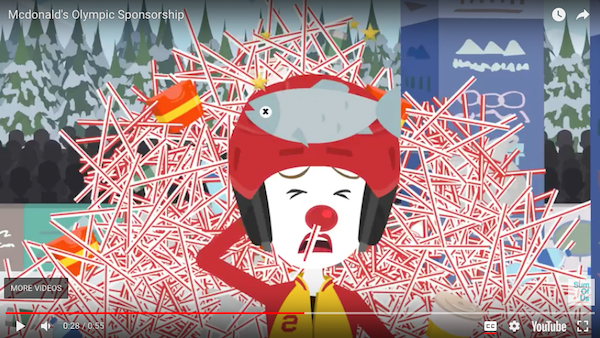 A clown like character dressed in ski clothes crashes into a pile of plastic waste at the end of a ski jump slope