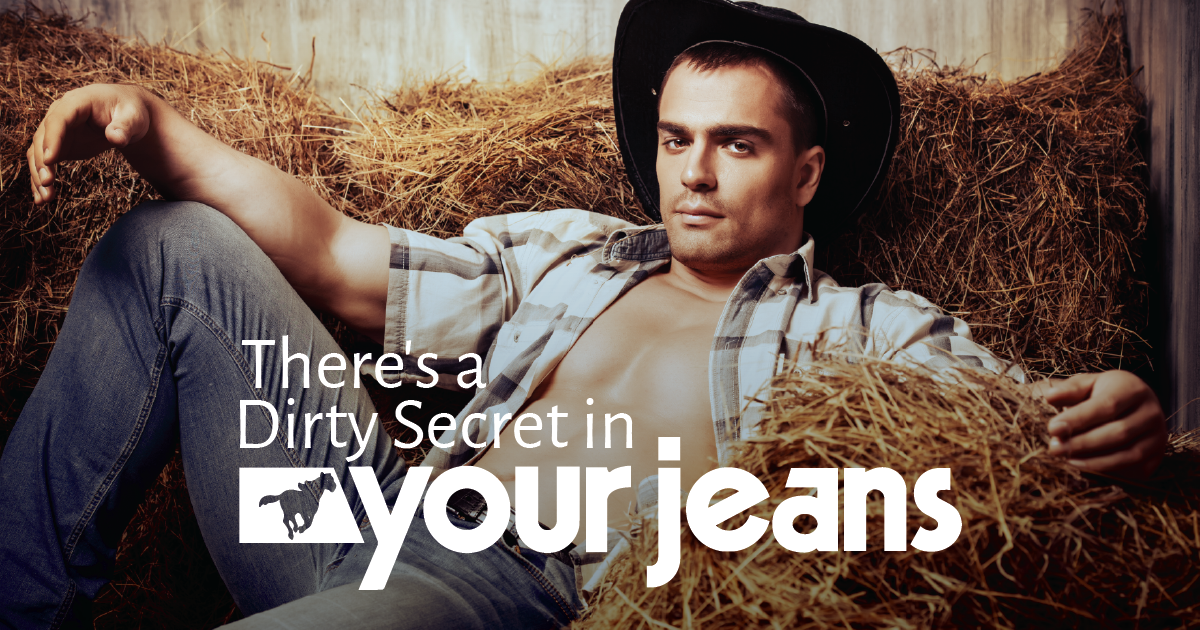 A male model dressed as a cowboy wearing denim sounded by hay bails with the Wrangler logo and text displayed that says There's a dirty secret in your jeans