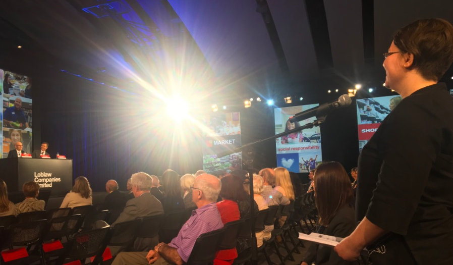 SumOfUscampaigners Amelia Meister delivering 14,000 signatures inside the Loblaw AGM