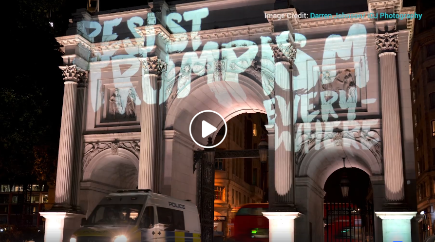 video still image of marble arch with the words resist trumpism everywhere with link to the video