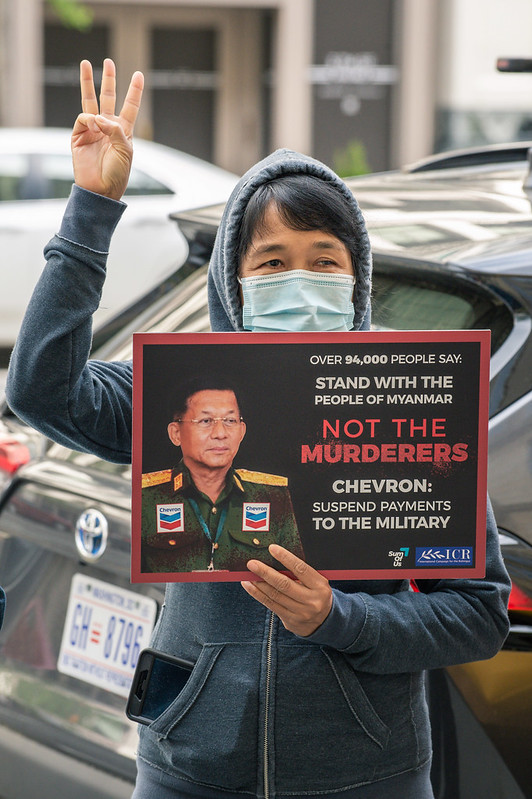 burmese activist holds petition placard