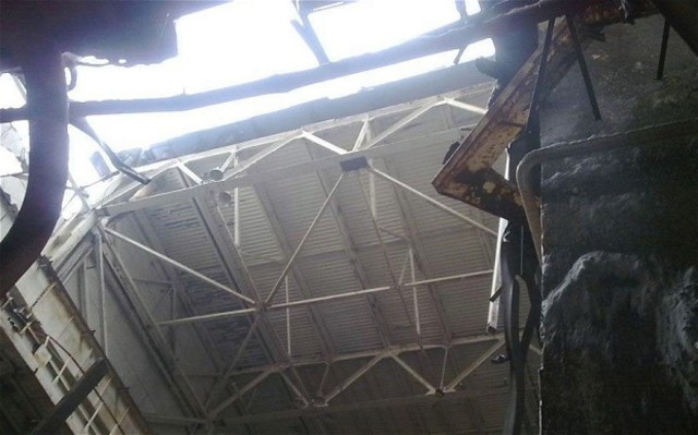 A section of power plant roof collapses after heavy snowfall. The “sarcophagus”, 50 metres away, is unaffected.