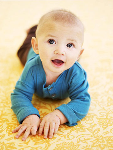 When lying on stomach, pushes up to elbows