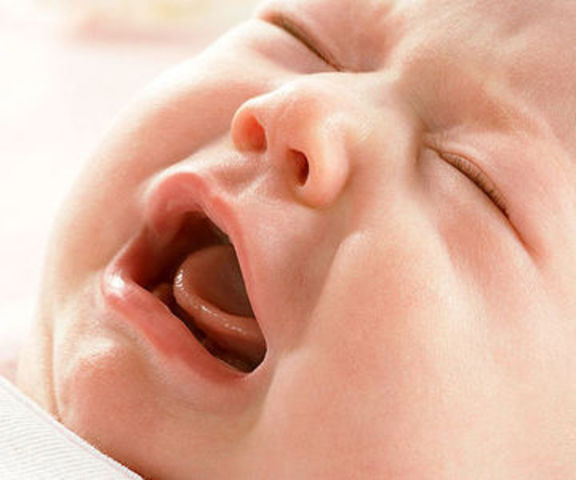 Cries in different ways to show hunger, pain, or being tired