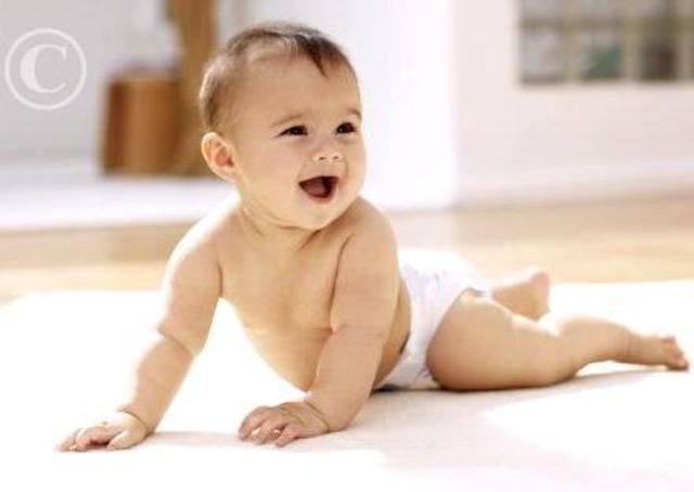 Can hold head up and begins to push up when lying on tummy