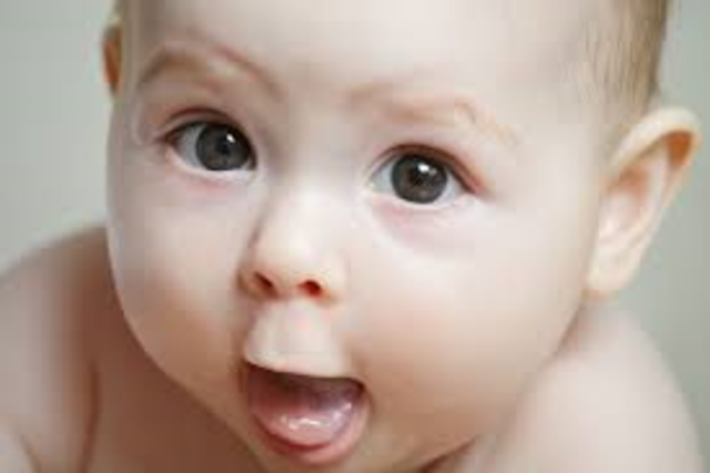 Babbles with expression and copies sounds he hears