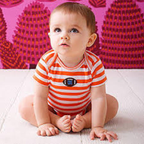 Begins to sit without support