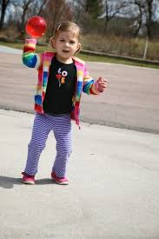 Throws ball overhand