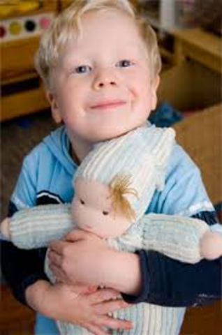 •Plays simple pretend, such as feeding a doll