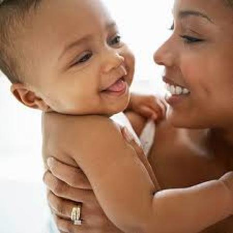 Baby try's to look or smile at parents