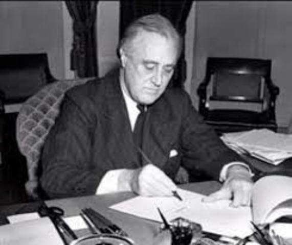 Pres. Roosevelt signs the Lend-lease act