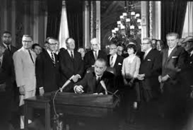 President Johnson signs Voting Rights Act