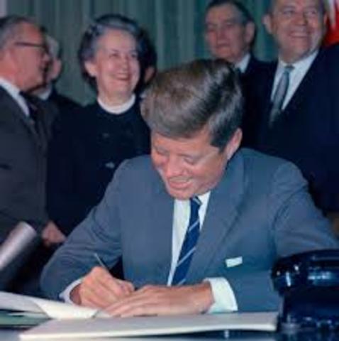 John F Kennedy signs the Maternal and Child Health and Mental Retardation Amendment