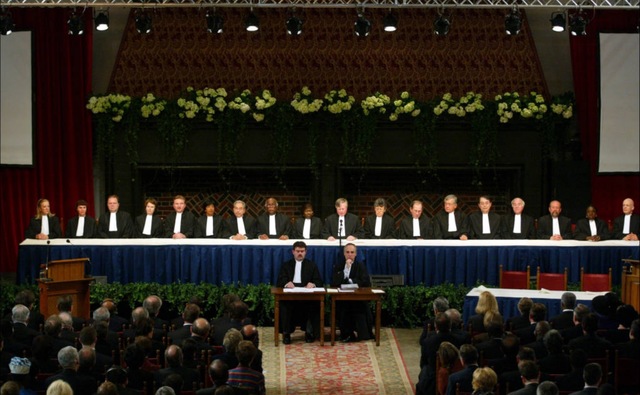 The ICC's First judges and prosecutor take the oath. The begin to work on Uganda.
