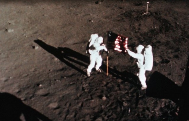 Neil Armstrong & Buzz Aldrin Become First Human Beings to Walk on the Moon