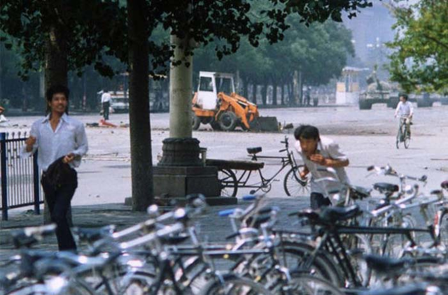 The Tank Man in Tiananmen Square, China. He's to the left of the bulldozer.