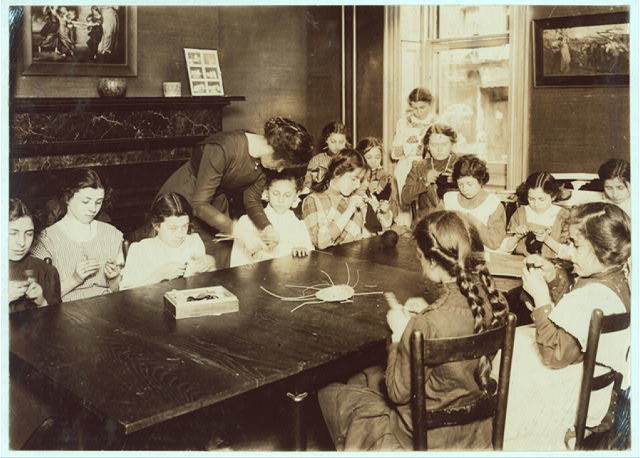 Lillian Wald Opens Settlement House in New York City Photo: Hine, Lewis. Knitting Class, Henry Street Settlement. May 1910. Records of the Department of Commerce and Labor, Children's Bureau, National Archives and Records Administration, Washington, D.C.