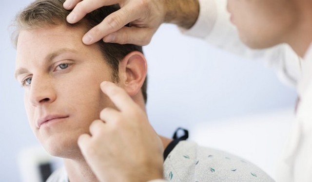 see a dermatologist to screen for skin cancer