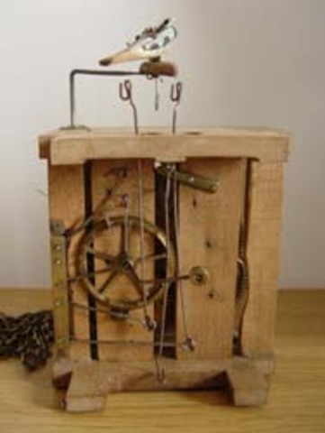 Reloj de pesas y ruedas