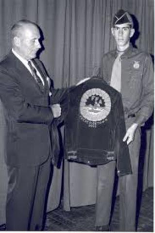 Blue corduroy jacket adopted as Official Dress.