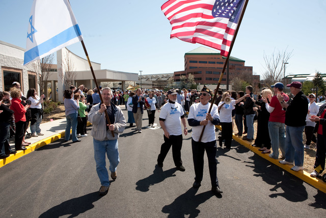 Members of Beth El walk 6½ miles transporting 10 Torahs to the new synagogue in Voorhees