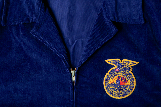 Blue corduroy jacket. FFA officers greeted by president