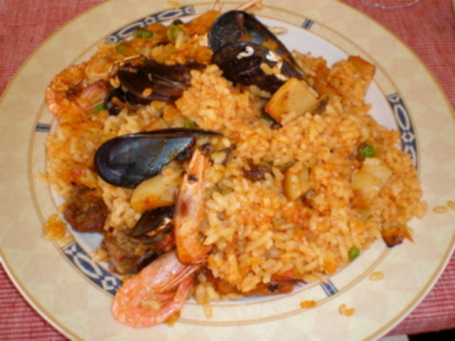 A village of El Palmar in Valencia, Spain, invents the rice dish named "paella". Catalonians (people from the Catalonia region of Spain, such as Barcelona) often make this dish with seafood.