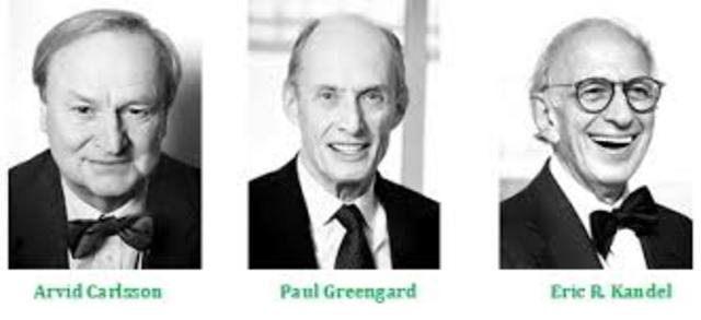 Arvid Carlsson (Suecia, 1923-), Paul Greengard (E.EU.U., 1925-) y Eric R. Kandel (E.E.U.U., 1929-)