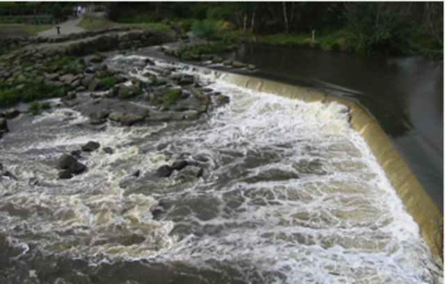 The first weir at Dights Falls was built