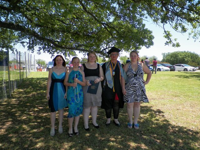 Me growing up (pictured is my A&M graduation my daughters were the ones there for the graduation)