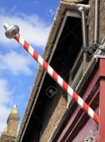 Barber surgeons cut hair, perform surgery, barber pole symbol popularized