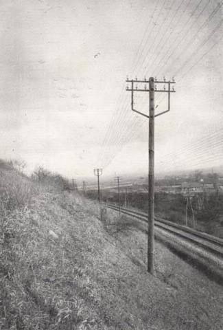 The first long-distance outdoor telephone line is invented.