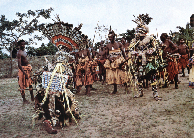 Mwashamboy and Bwoom maskers in a royal ceremony among the Kuba