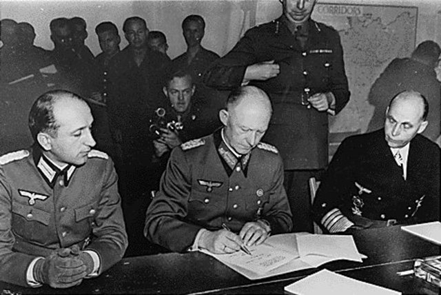 World War II: General Alfred Jodl signs unconditional surrender terms at Reims, France, ending Germany's participation in the war. The document will take effect the next day.