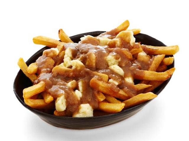 Eating Poutine in Montreal.