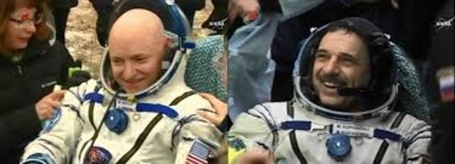 Astronauts return from earth after 340 day space mission