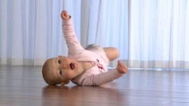 Turns from stomach to back