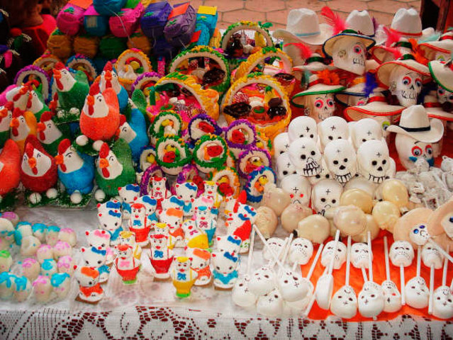 The people go back home and finish up decorating the altars for the spirits of the children