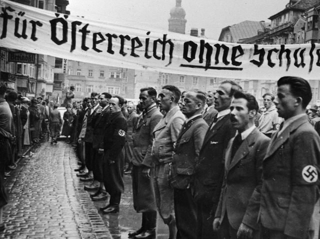 Adolf Hitler releases Nazis that were imprisoned in Austria