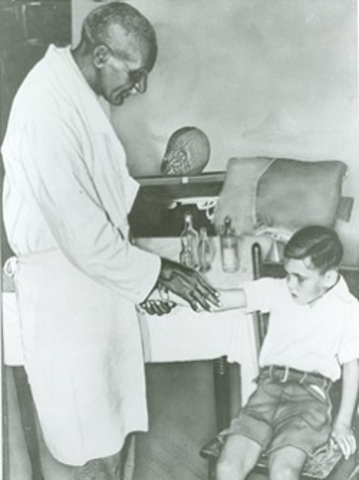 George Washington Carver works with peanut oil to help cure polio.
