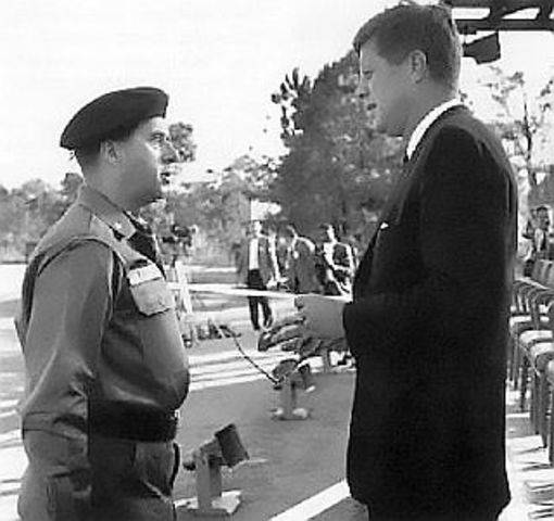 President John F. Kennedy sends helicopters and 400 Green Berets to South Vietnam