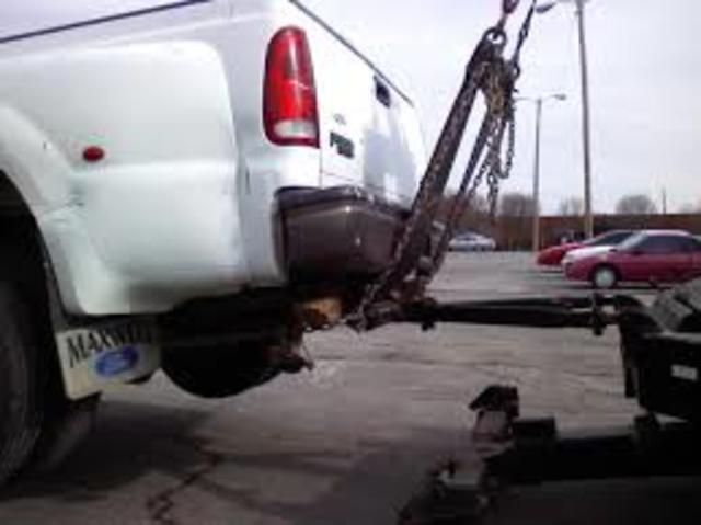 Modern day tow truck-Hook and chain/Belt lift Tow Truck